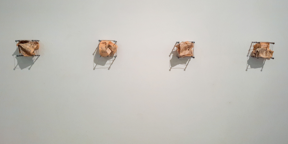 Small Matters. Book pages, nails, wire, vinyl type. 1988. Dimensions variable. Collection of The Remai Modern.