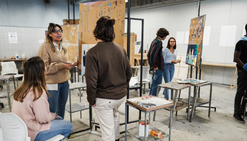 Art instructor in art class