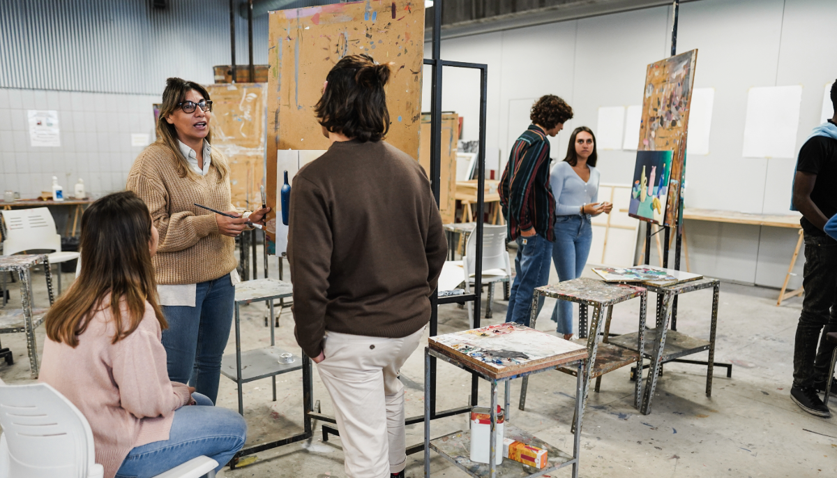 Art instructor in art class